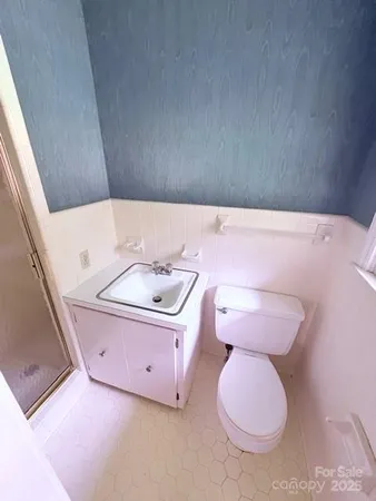 a bathroom with a sink a toilet and tub