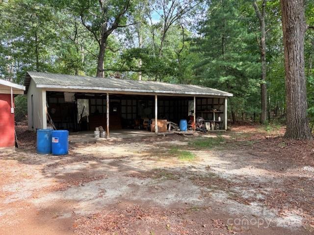 507 Poplar Springs Church Road Shelby, NC 28152 - Photo 39 of 47 a view of a house with backyard porch and sitting area