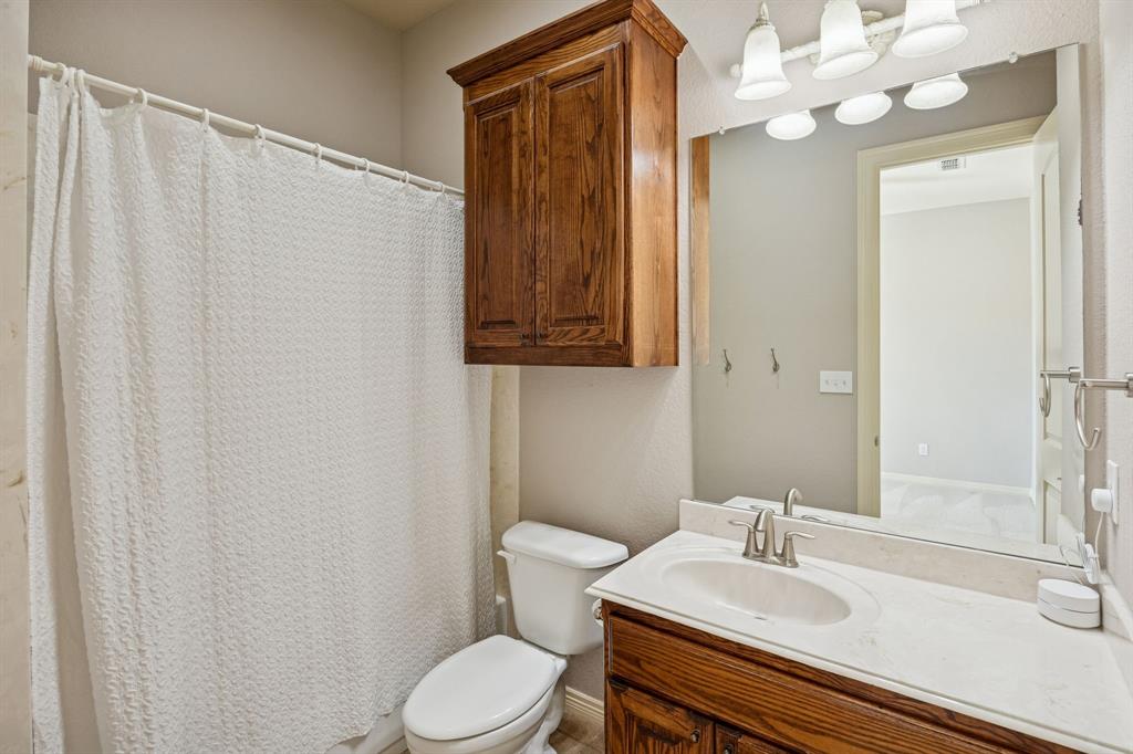 1520 Snider Court Lucas, TX 75002 - Photo 19 of 40 Ensuite bathroom with a bank of built in solid wood cabinets behind the door.