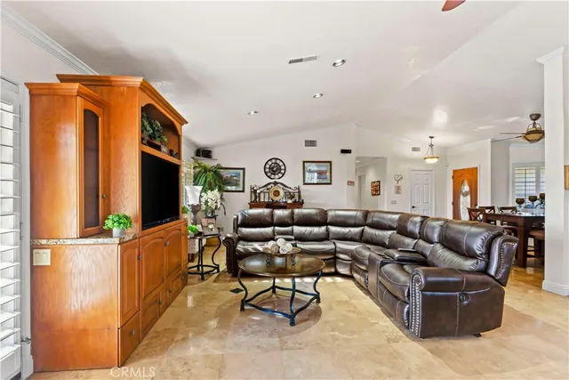 a kitchen with stainless steel appliances granite countertop a sink a stove and refrigerator