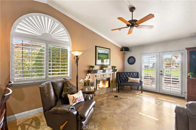 a view of a hallway with wooden floor and entryway