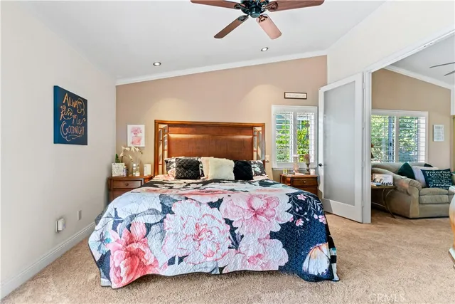 a view of walk in closet with clothes