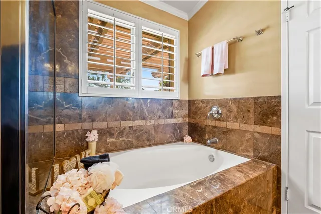 a bedroom with bed and painting on the wall