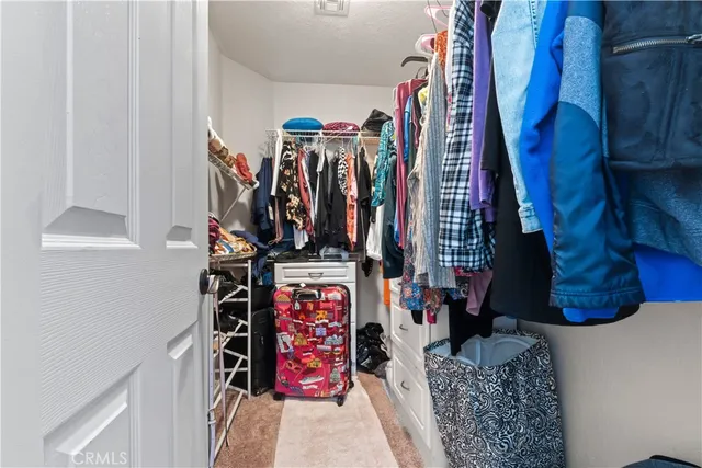 a bathroom with a toilet and a mirror
