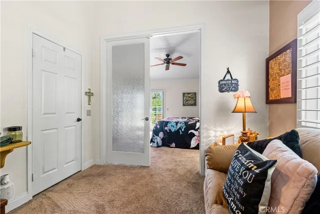 a view of living room with furniture and a window