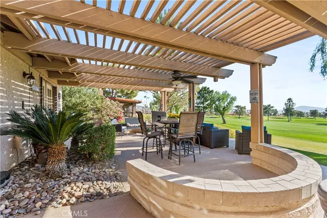 an aerial view of a house a swimming pool outdoor seating and yard