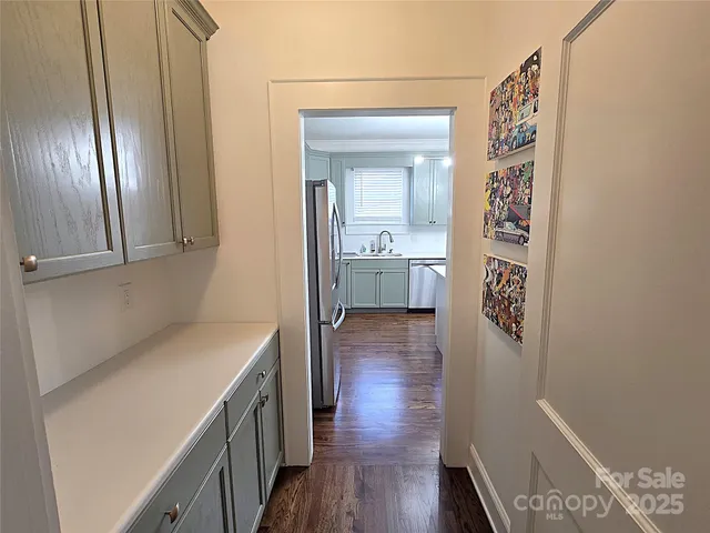 a kitchen with a refrigerator and sink