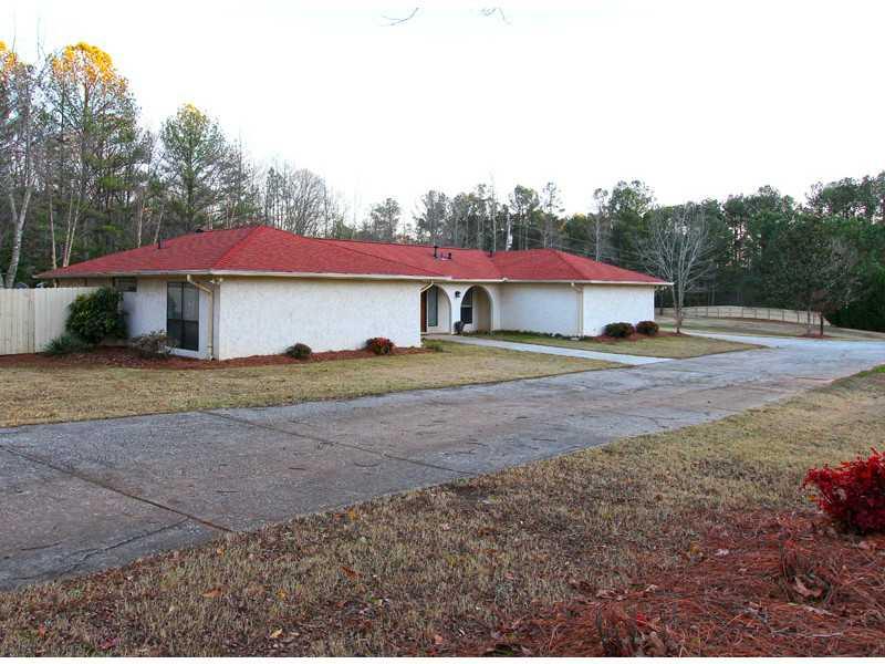 524 Casteel Road Marietta, GA 30064 - Photo 1 of 1 a view of big yard with large tree and plants