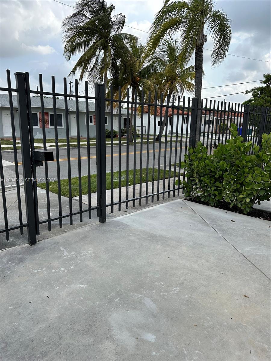 551 Southwest 57th Avenue, Unit 1 Miami, FL 33144 - Photo 23 of 24 a view of a wrought iron fences in front of house