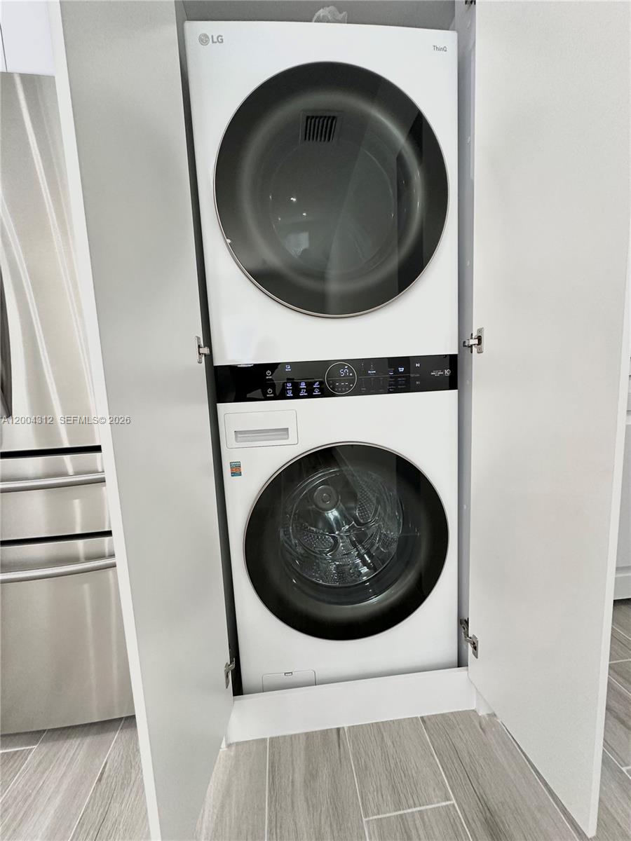 551 Southwest 57th Avenue, Unit 1 Miami, FL 33144 - Photo 8 of 24 a utility room with dryer and dryer