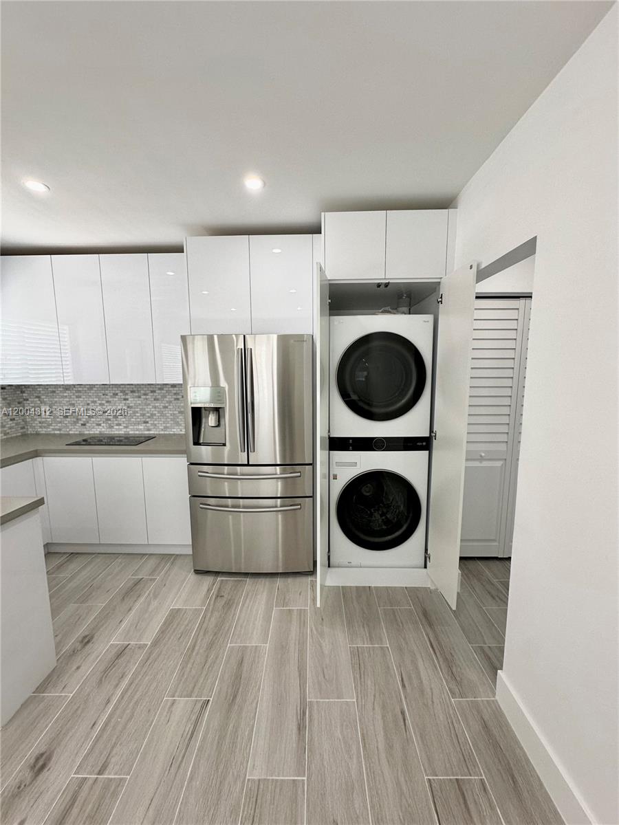 551 Southwest 57th Avenue, Unit 1 Miami, FL 33144 - Photo 9 of 24 a kitchen with a washer and dryer