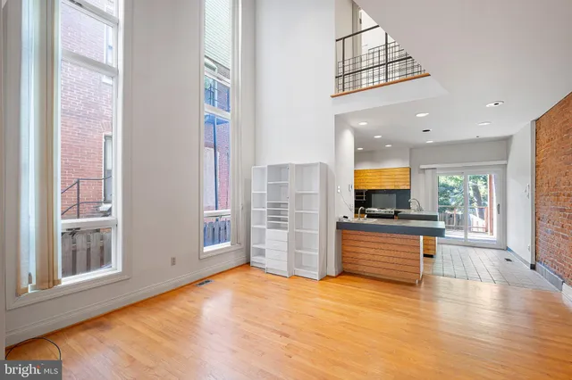 a view of kitchen with stainless steel appliances granite countertop a stove and a refrigerator
