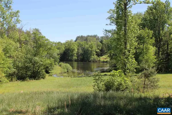 a view of a lake with a yard