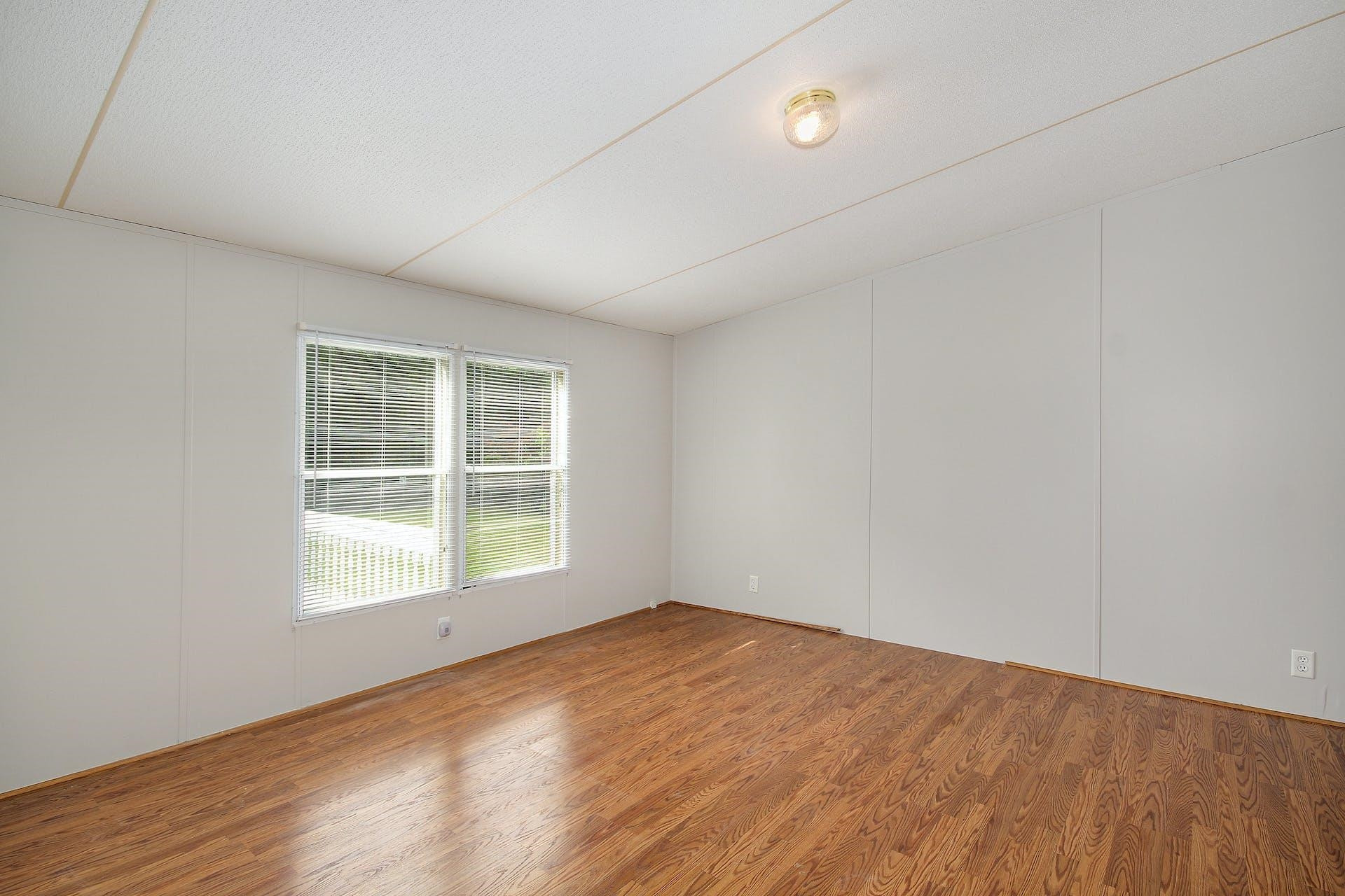 8144 Mt Pleasant Church Road Willow Spring, NC 27592 - Photo 13 of 25 an empty room with a window