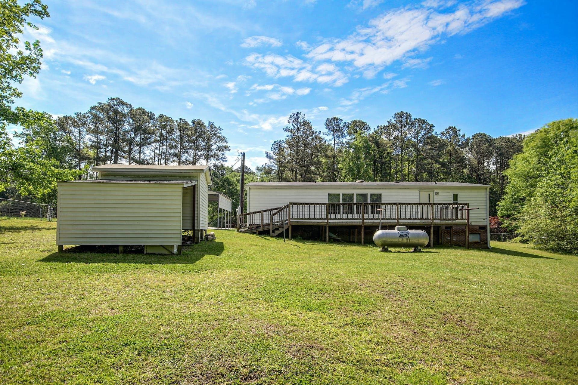8144 Mt Pleasant Church Road Willow Spring, NC 27592 - Photo 21 of 25 a view of a house with yard and sitting area