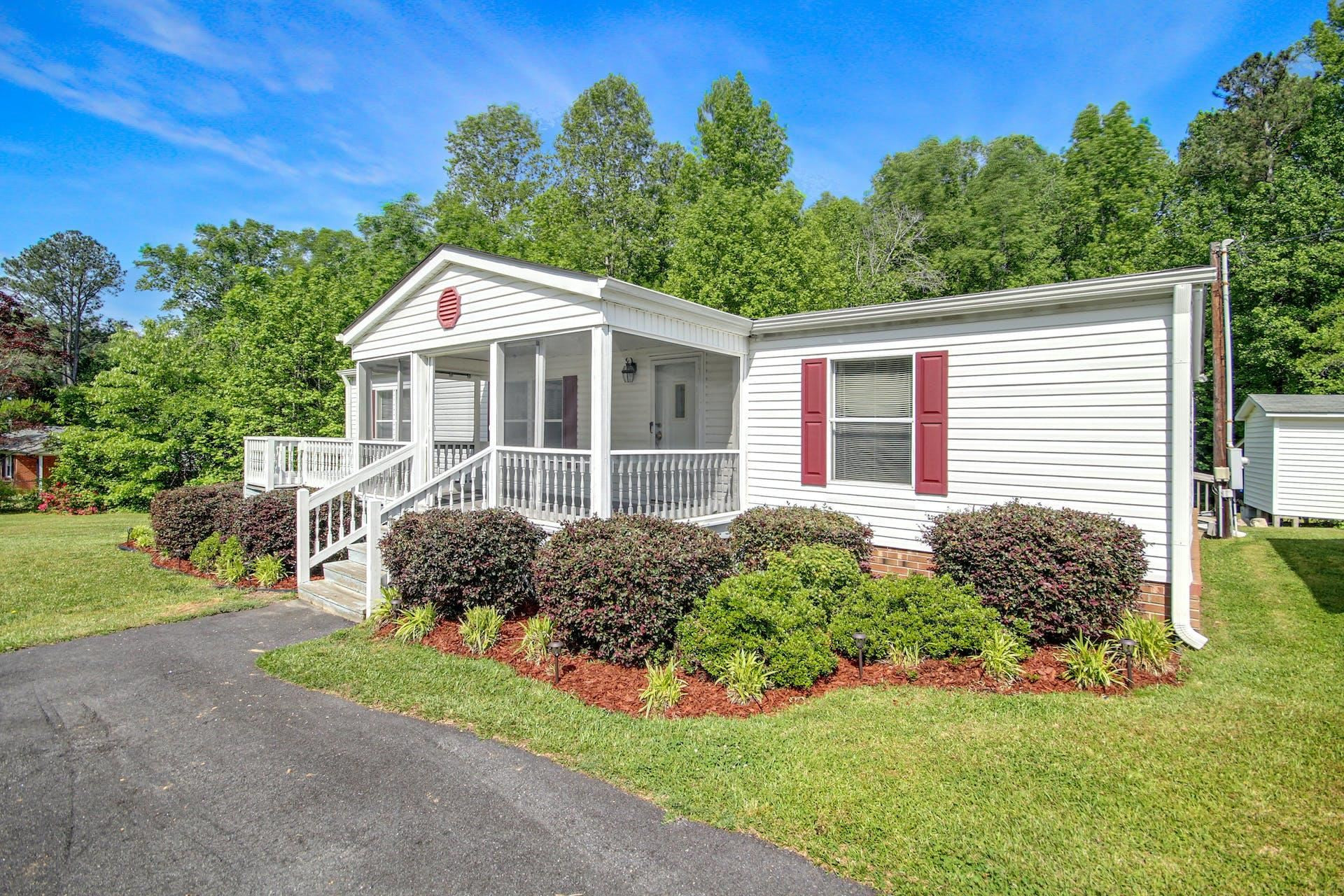 8144 Mt Pleasant Church Road Willow Spring, NC 27592 - Photo 4 of 25 a front view of a house with a yard