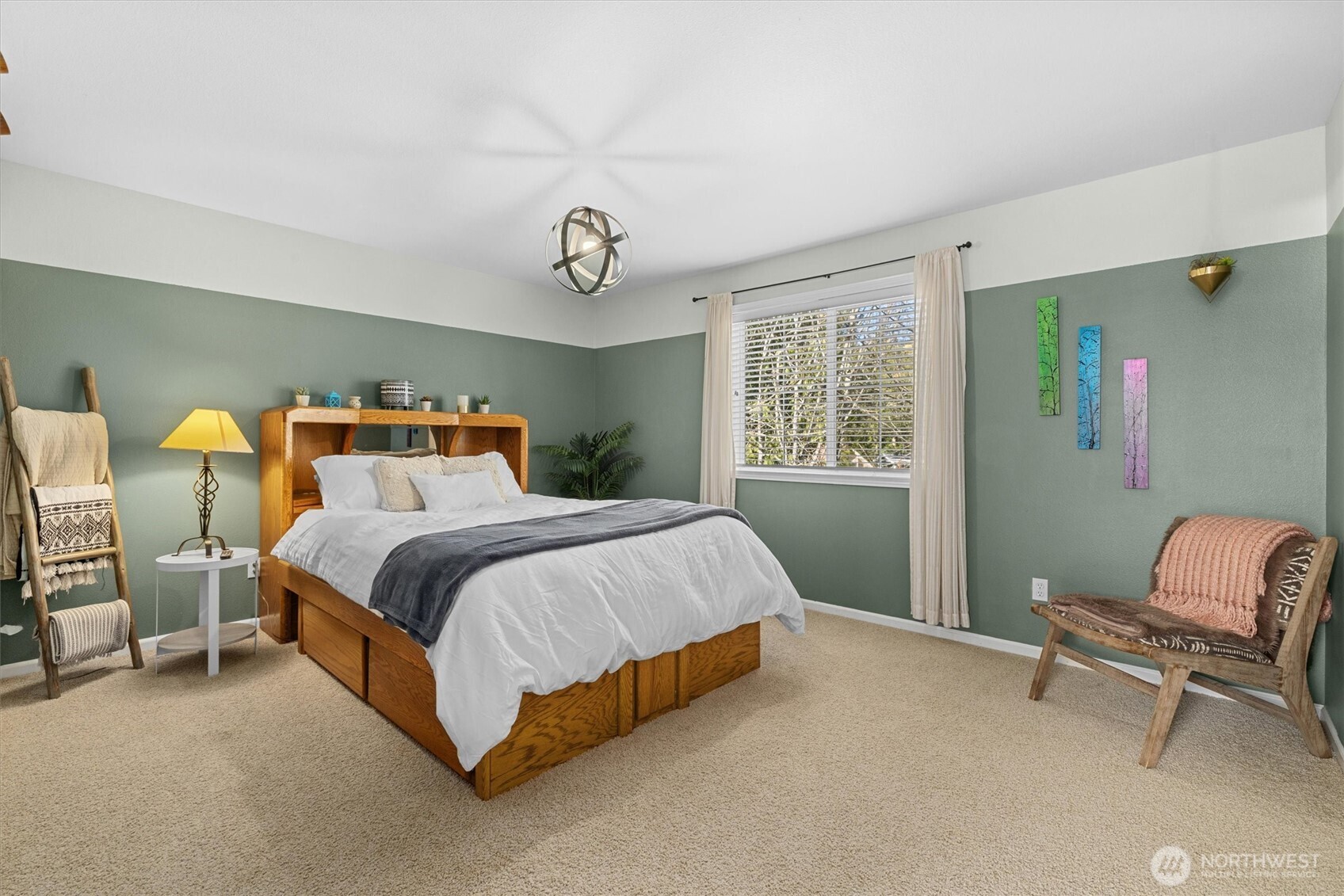 481 Maple Grove Road Port Angeles, WA 98363 - Photo 18 of 40 a bedroom with a bed and a chair