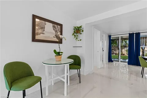 a workspace with furniture and a potted plant