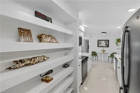 a view of a house with backyard and porch