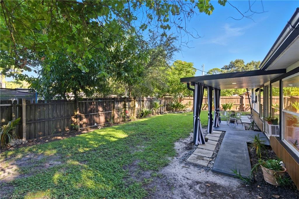 1280 Pine Street Naples, FL 34104 - Photo 35 of 36 a view of a house with backyard and porch