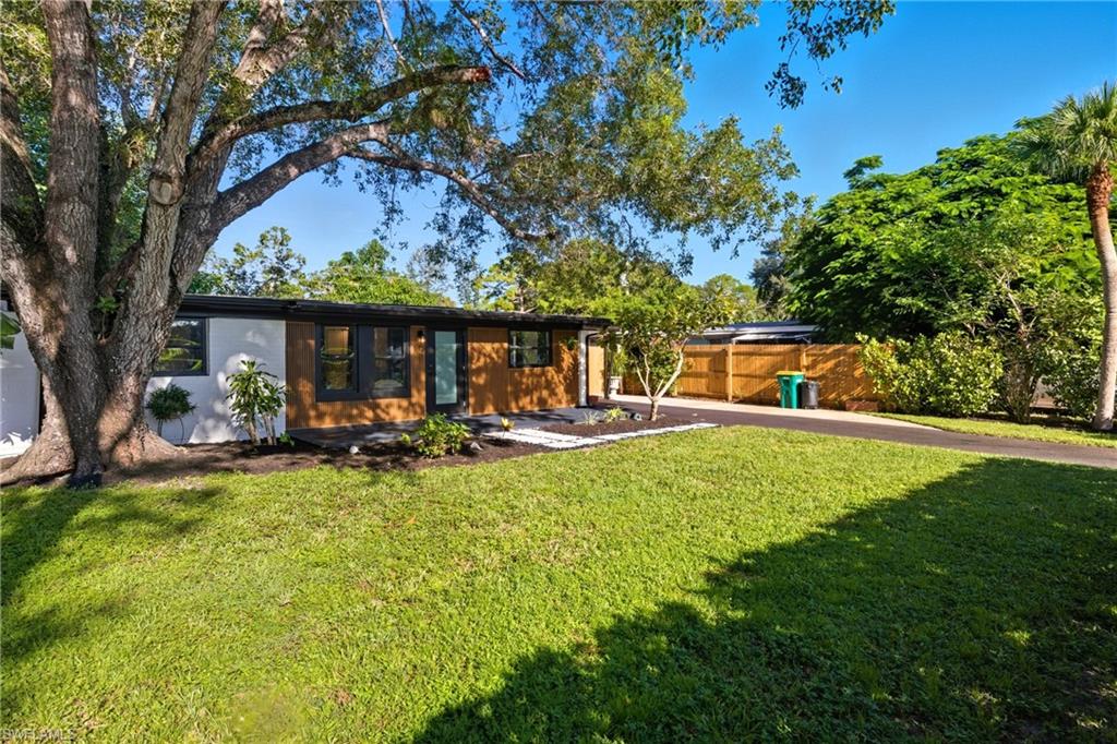 1280 Pine Street Naples, FL 34104 - Photo 36 of 36 a view of a house with swimming pool and sitting area