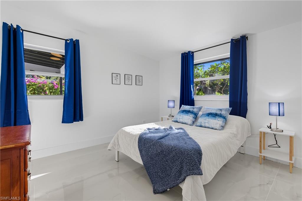 1280 Pine Street Naples, FL 34104 - Photo 6 of 36 a bedroom with a bed and a window
