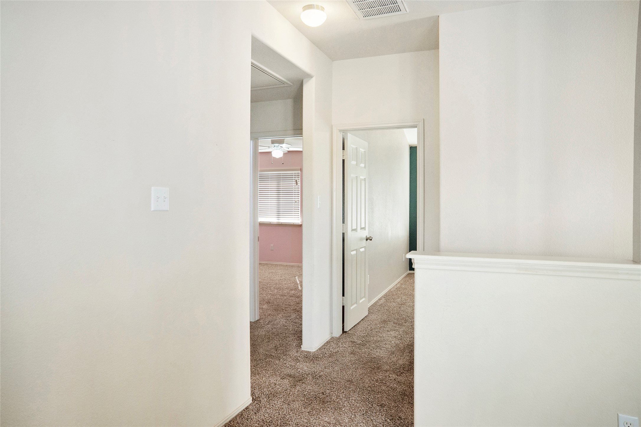 212 Foster Lane Jarrell, TX 76537 - Photo 13 of 22 Upstairs carpeted hallway leading bedrooms