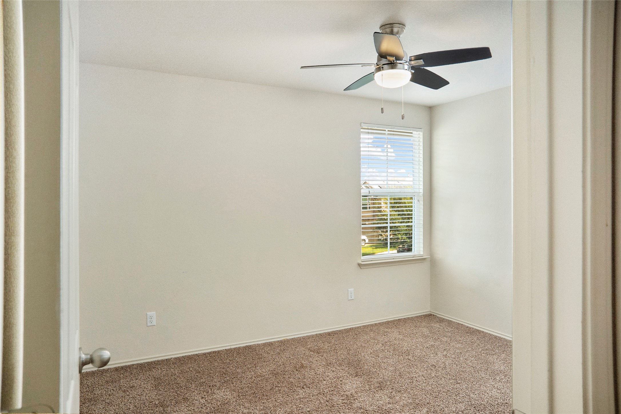 212 Foster Lane Jarrell, TX 76537 - Photo 15 of 22 Bedroom with plush carpeting, ceiling fan with light, and window