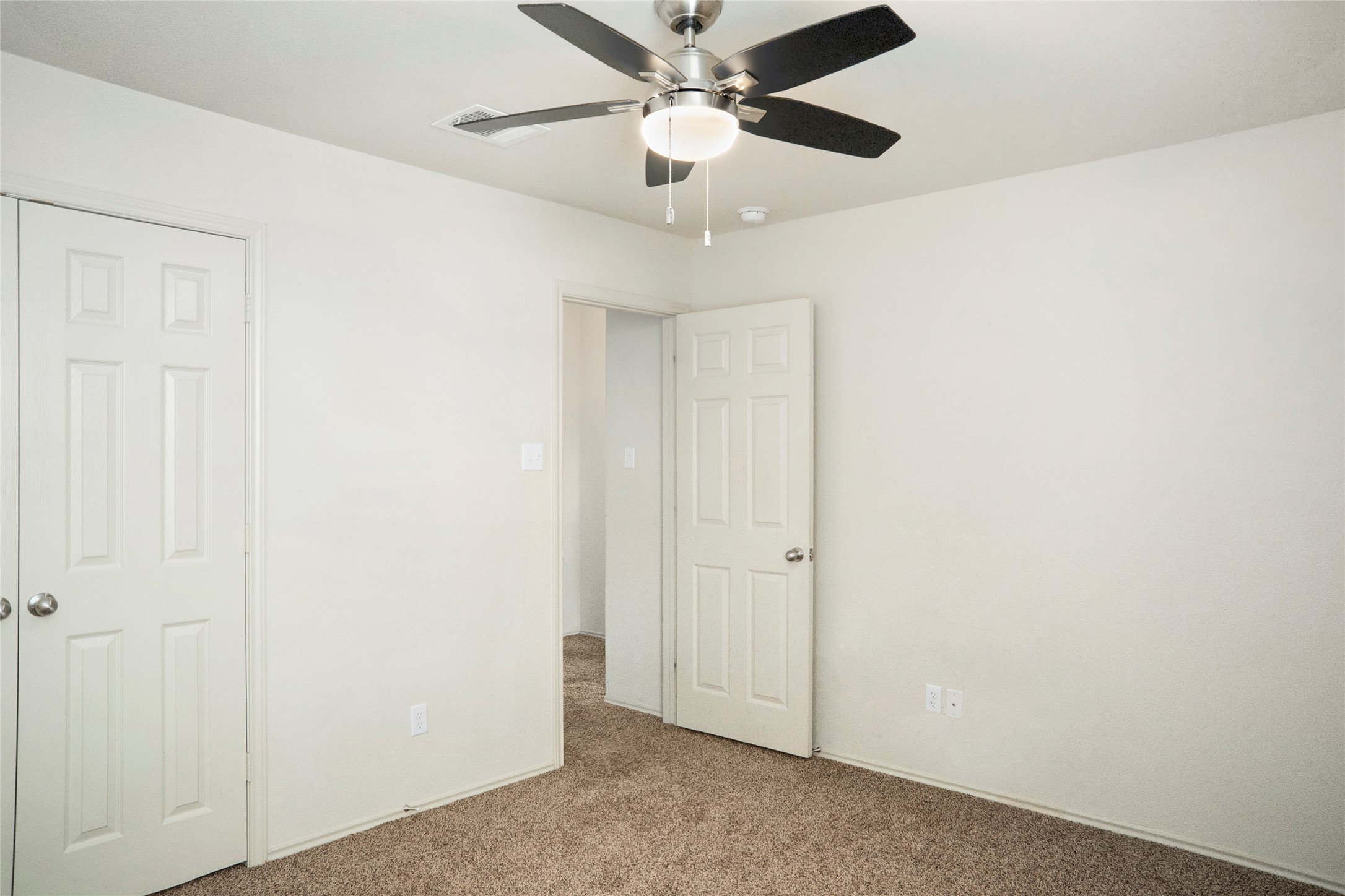 212 Foster Lane Jarrell, TX 76537 - Photo 16 of 22 Neutral-toned walls complement plush carpeting and double-door closet space