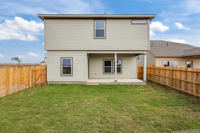 a house that has a big yard in front of it