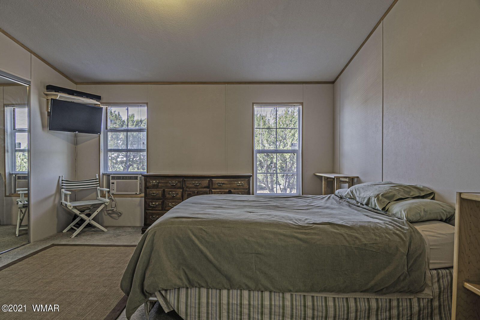 11 County Road Concho, AZ 85924 - Photo 23 of 35 a bedroom with a bed a table and windows