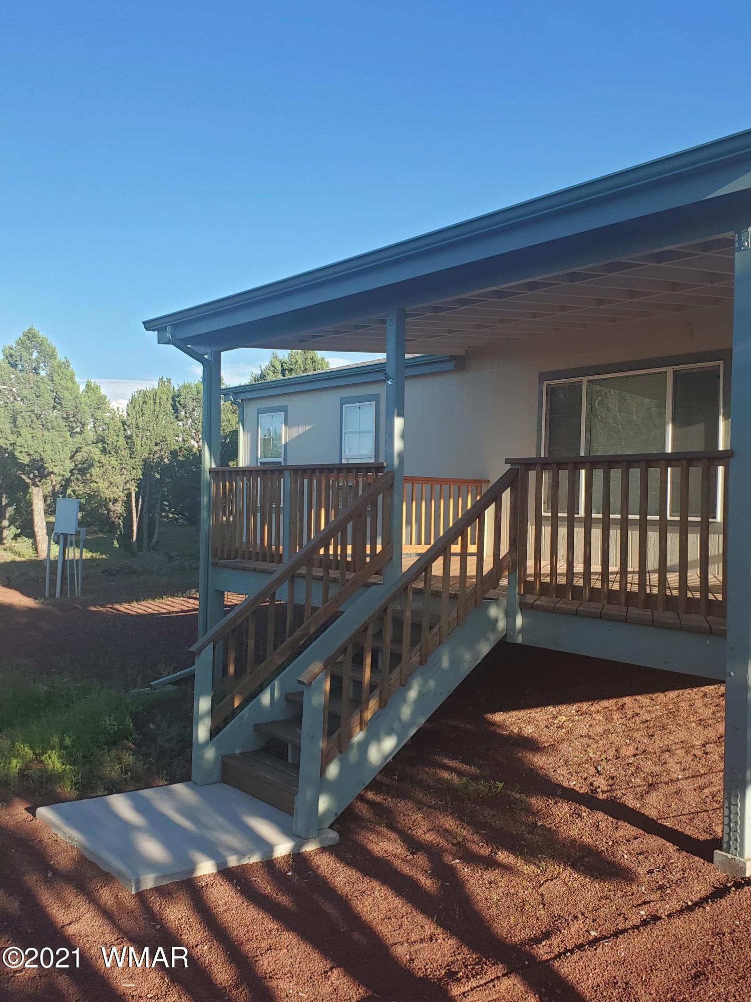 11 County Road Concho, AZ 85924 - Photo 3 of 35 a view of balcony with wooden floor