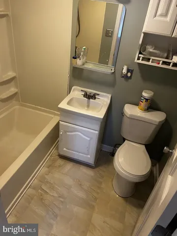 a bathroom with a toilet and a sink
