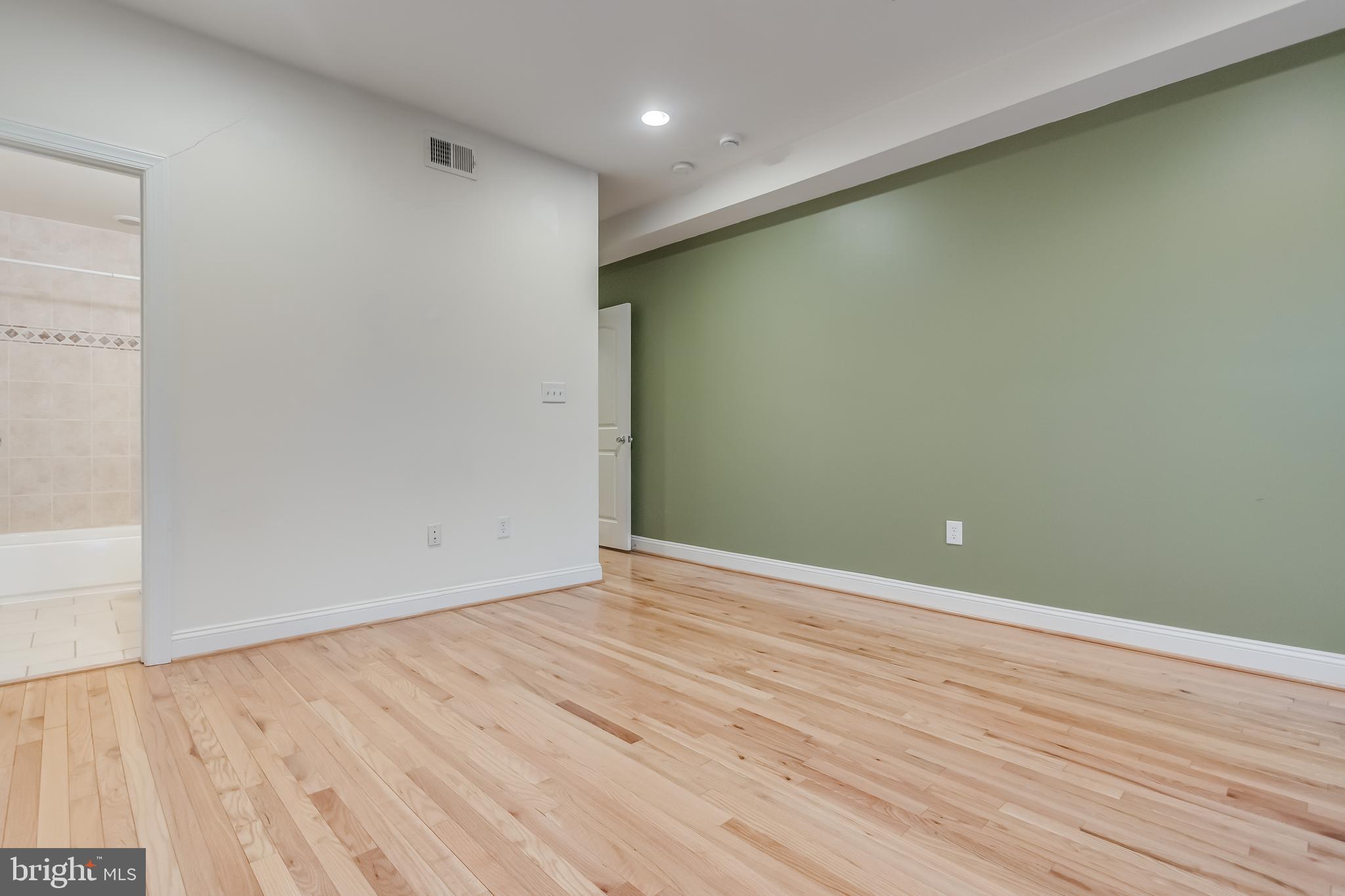 2307 18th Street Northwest, Unit 1 Washington, DC 20009 - Photo 15 of 21 a view of an empty room with wooden floor