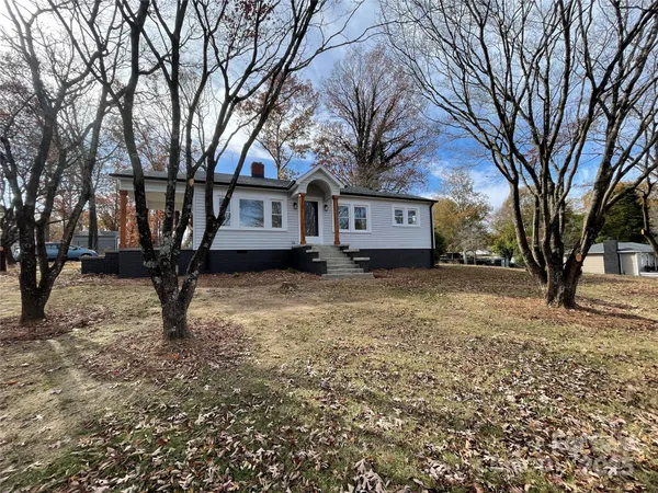 a view of house with trees in the background