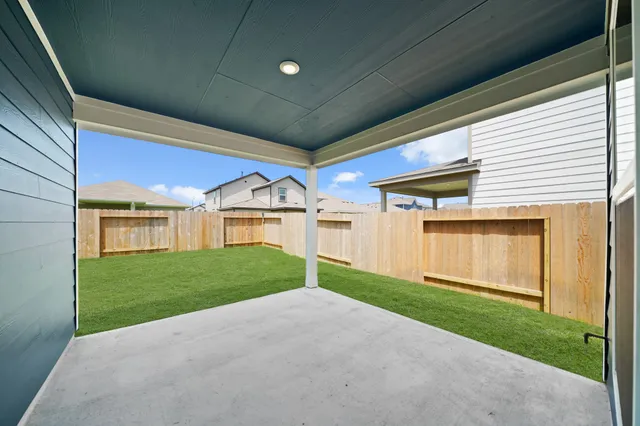 a view of a house with a yard and garage