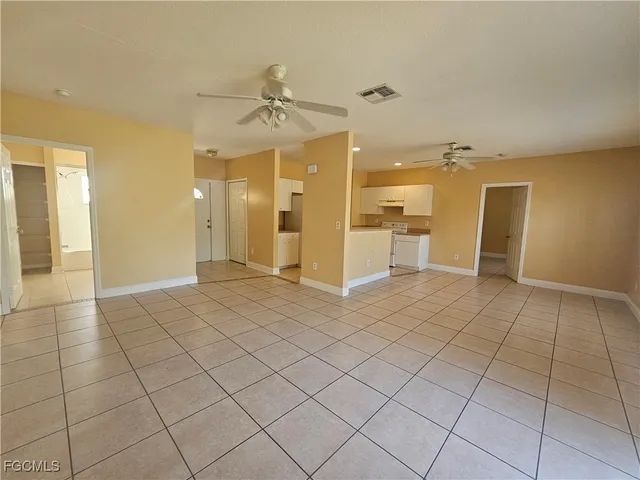 a view of a livingroom with a furniture and a chandelier fan