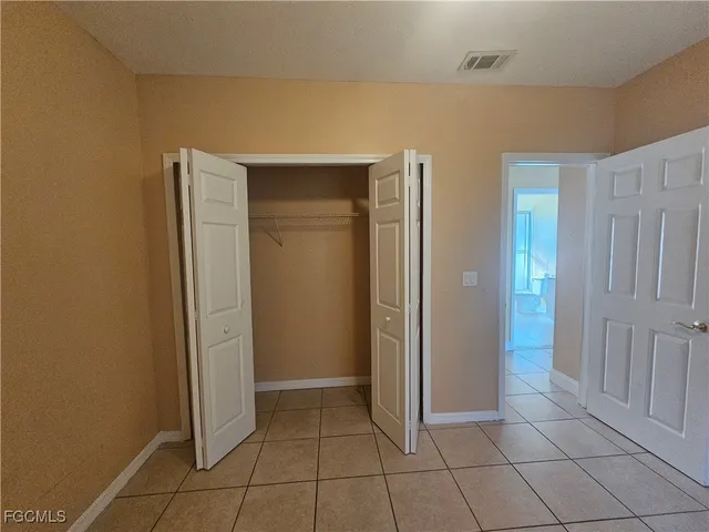 a bathroom with a double vanity sink and toilet