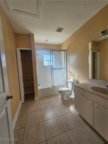 an empty room with a empty space and windows