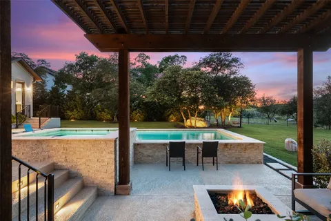 a view of a swimming pool with a patio