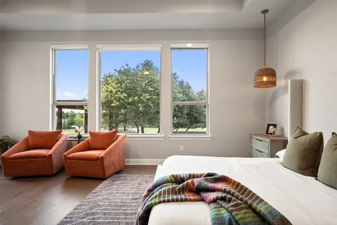 a bed room with a bed and a television