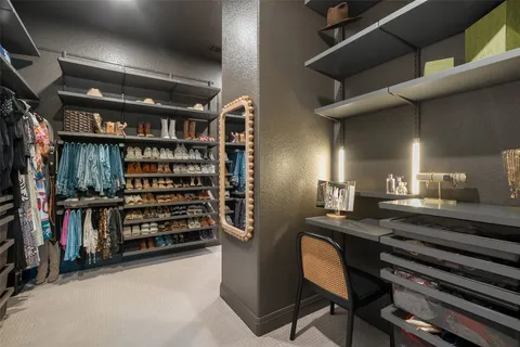 a view of a balcony with wooden floor and outdoor seating