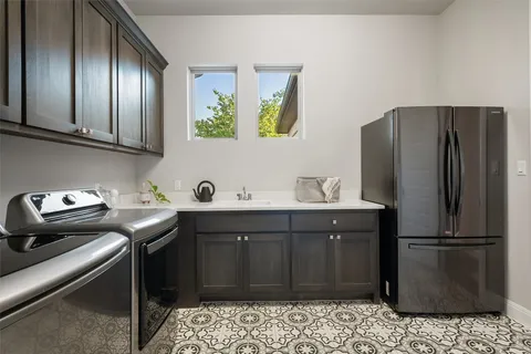 a view of a table and chairs in the garden
