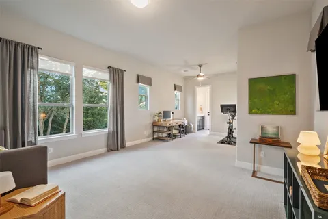 a view of a backyard with sitting area