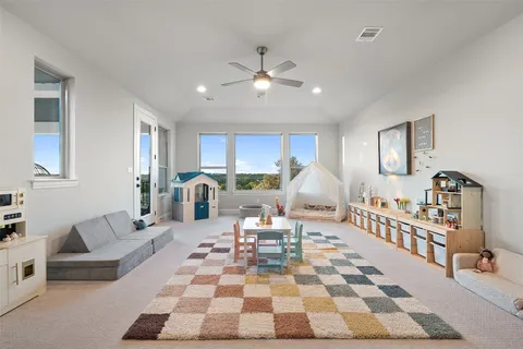 a view of a terrace with couches and pool