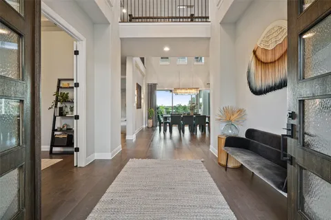 a view of a patio with couches potted plants and a table