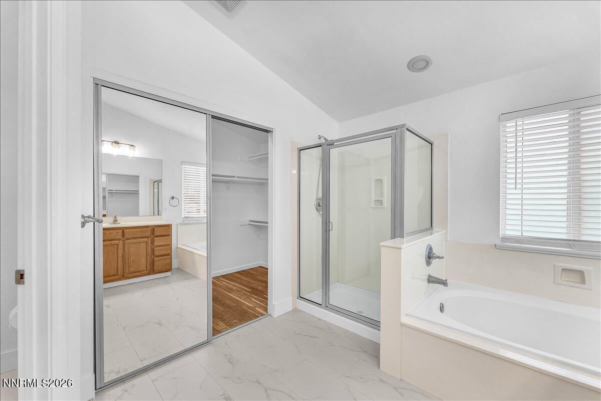 2329 Red Maple Court Reno, NV 89523 - Photo 23 of 39 a bathroom with a tub shower and sink