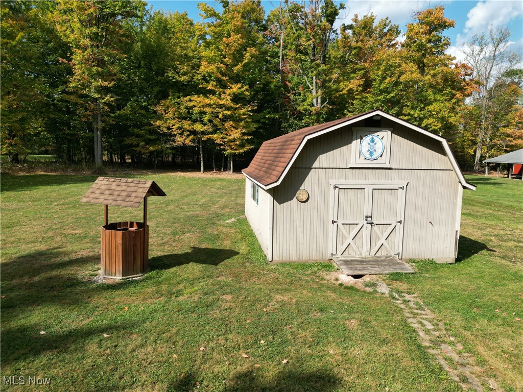 10050 New Buffalo Road Canfield, OH 44406 - Photo 45 of 49 View of shed with a lawn