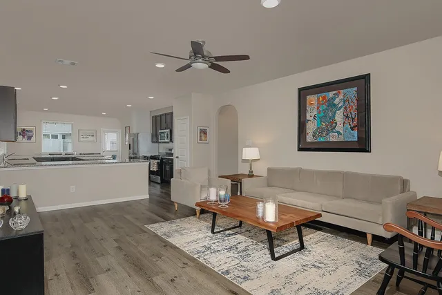 a living room with furniture and a rug