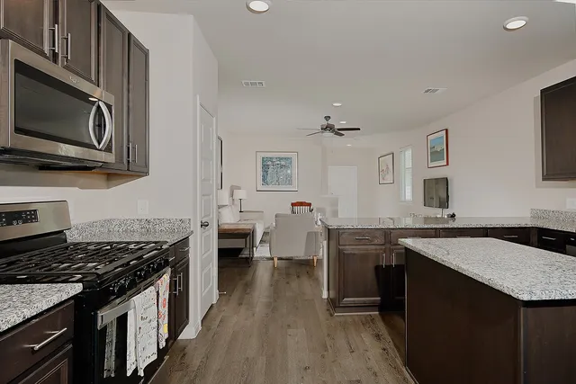 a kitchen with a stove sink and microwave